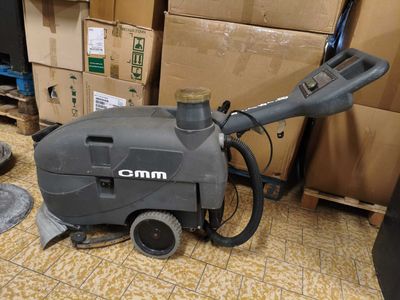 a machine that is sitting on the floor next to boxes