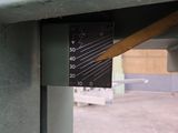 a close up of a meter on the side of a building