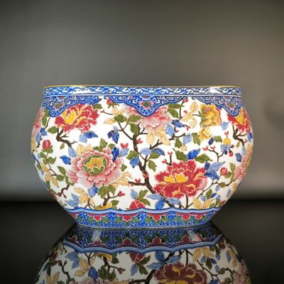 a close up of a bowl with flowers on it