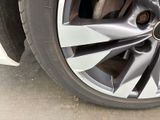a close up of a tire on a car ' s rim