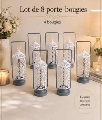 six lanternes décoratives en verre ornées de dentelles, posées sur une table