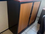 an image of a cubicle with a desk and a chair