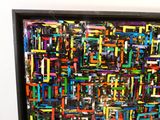 la photo d'un tableau coloré accroché au mur