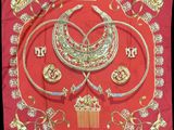 a red scarf with gold and silver jewelry on it