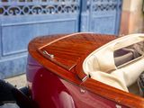 a close up of a small wooden boat with luggage in it