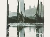 a black and white photo of a gondola in the water