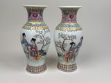 pair of oriental vases with asian women on them on a white background