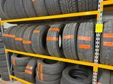 a lot of tires on the shelves in the store