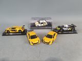 three yellow toy cars sitting on top of a table next to each other
