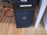 a dell desktop computer sitting on a hard wood floor