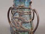 a blue vase with a dragon on it sitting on a table