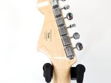 a close up of a guitar head with a white background