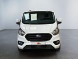 the front of a white ford transit van parked in a white room
