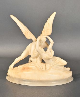 carved ivory figurine of a woman and a man on a boat