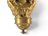 a gold statue of a woman with a crown on her head