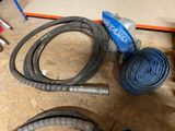 two hoses that are sitting on the floor next to each other