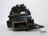 an image of a black printer unit sitting on top of a table