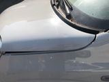 a close up of a car ' s hood with the hood open