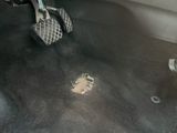 a small hole in the floor of a car