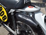 a close up of a motorcycle parked on the side of the street