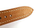 leather watch strap with stitching and stitching on a white surface