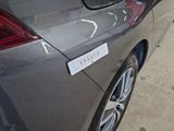 a close up of a car with a sticker on the back of it