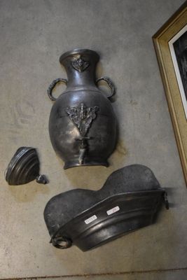 a picture of a wall with a vase and other items on it
