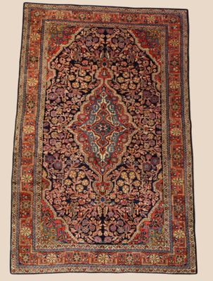 an antique persian rug with a floral design