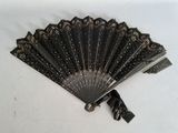 a black fan that is sitting on a white table