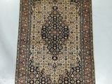an antique persian rug on a white background