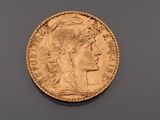 an image of a gold coin with a woman ' s head on it