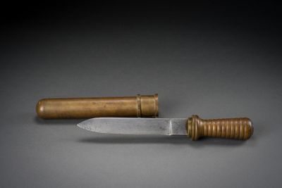 a knife and a wooden handle on a table