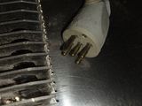 a close up of a piece of metal that has a plug attached to it