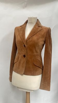 brown sued jacket on a mannequin dummy on a white background