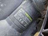 a close up view of a corded sander on a table