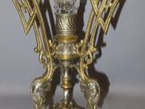 a glass vase that is sitting on a stand
