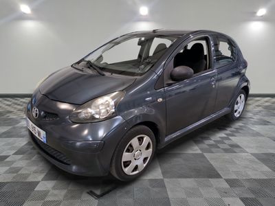 a picture of a small car parked in a garage