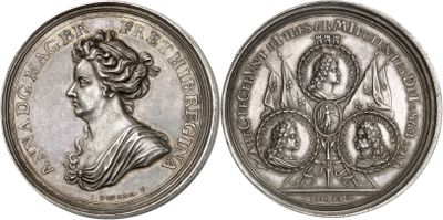 a close up of a silver coin with a woman on it