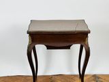 an image of a small wooden table with a leather top