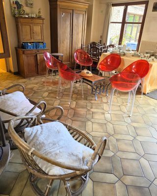 many chairs and tables in a room with a table and chairs