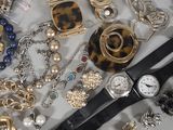 many different types of jewelry on the table
