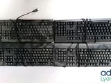 a lot of keyboards sitting on top of each other