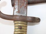 a close up of a knife on a wall