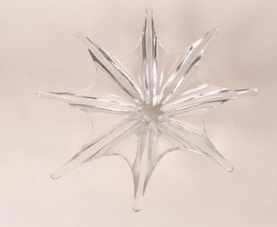clear glass star ornament on a white background