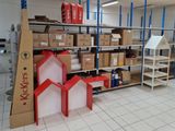 many boxes and boxes on the shelves in the room