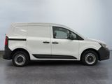 the white van is parked on the concrete floor in the room