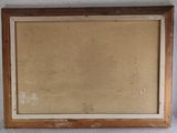an old picture frame hanging on a wall in a room