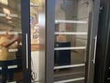 two glass doors that are open in a room