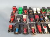a lot of toy trains that are sitting on a table