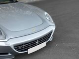 a silver sports car parked on the side of the road